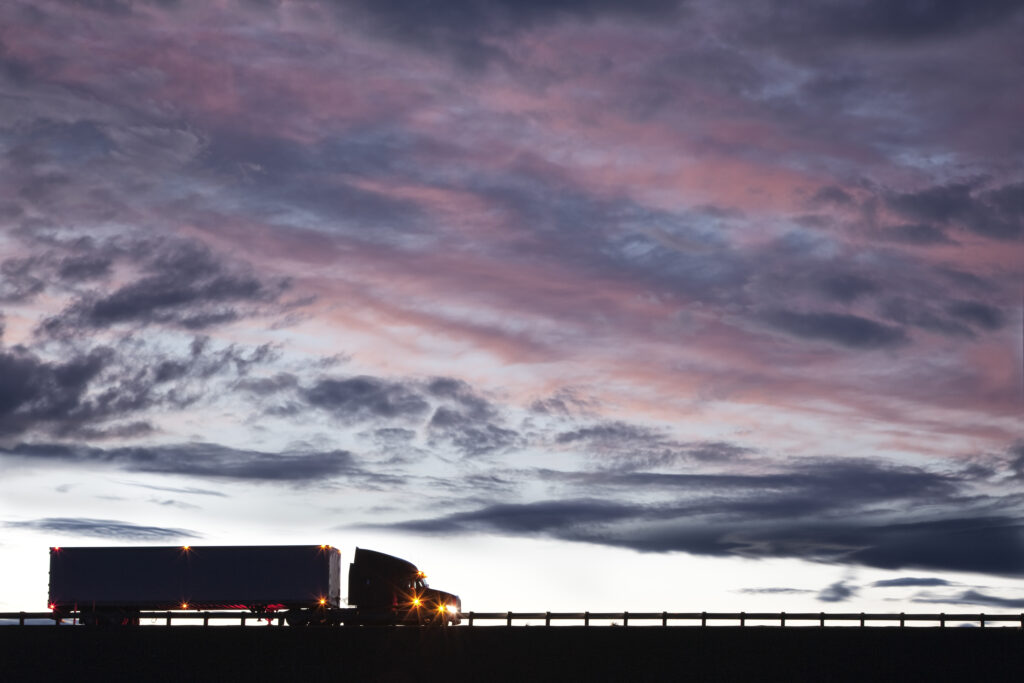 Silhouette Of A Commercial Truck Driving On A High 2025 04 05 11 18 00 Utc 1024x683